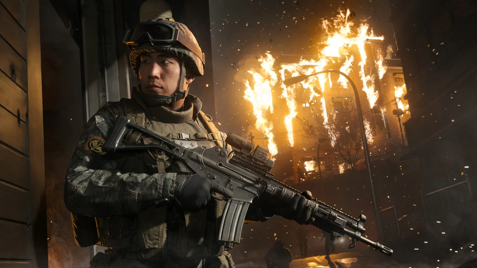 Soldado com fuzil diante de uma construção em chamas em captura de Call of Duty: Modern Warfare 4