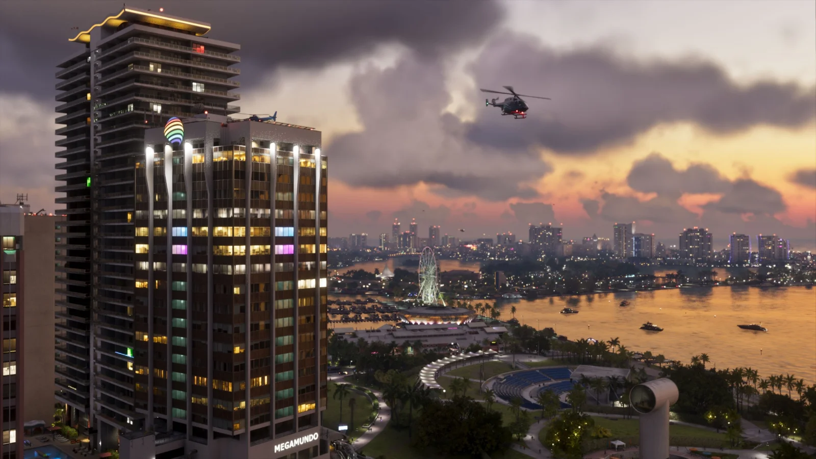 Vista de Vice City ao entardecer, com arranha-céus, o mar e um helicóptero, em imagem oficial de GTA 6